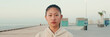 © Andrii Nekrasov - Close up of asian girl wearing sportswear looking at camera on morning time, Panorama