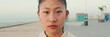 © Andrii Nekrasov - Close up of asian girl wearing sportswear looking at camera on morning time, Panorama