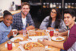 © peopleimages.com - Portrait, group and friends with pizza on table, smile and fast food to enjoy, eating and bonding. Students, dinner and people in cafeteria of restaurant, men and women in college, hungry and happy
