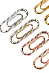 Poster - A group of metal paper clips on a white surface. Perfect for office or school supplies concept