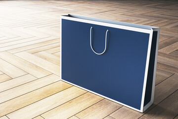 Poster - A blue paper shopping bag mockup with white handles on a wooden floor, ideal for branding and copyspace concepts. 3D Rendering
