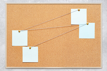 Fototapete - Blank paper notes are pinned to a cork board. The concept of detective investigation or training