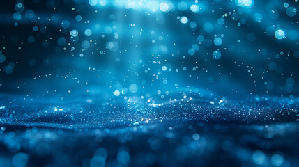 A clear blue ocean with sunlight shining through the water