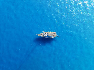 Wall Mural - summertime vacation. drone view on the yacht. sail yacht on the sea as a background. .sea and waves 
