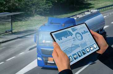 Poster - Manager with a digital tablet on the background of truck. Fleet management..