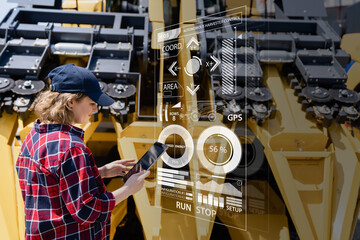 Fototapete - Woman farmer with digital tablet on a background of autonomous harvester. Smart farming concept.