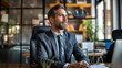© Александр Марченко - Thoughtful businessman sitting in an office, looking out the window
