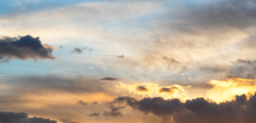 Wall Mural - sky background. bright orange sunset sky with clouds.