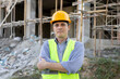 © Have a nice day  - Male caucasian technician engineer construction worker arms crossed, working in a building site with innovation analyzing planning, wearing safety vest and helmet gears.