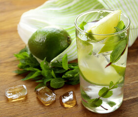 Wall Mural - lemonade with mint and lime mojito summer drink