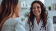 © YURIMA - In a medical setting, a female doctor is having a friendly conversation with a patient, smiling and giving advice to build trust. They discuss healthcare, patient care, and wellbeing