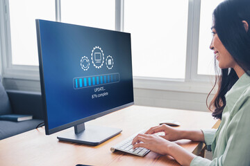 Fototapete - Working in office desktop Installing update system software for device operating systems to be up to date with the new version. Graphics icon showing updating function screen loading on computer.