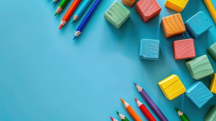 Mathematics Learning Concept with Colorful Fractions Cubes and School Supplies on Light Blue Background - Top View Copy Space