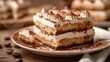 © SSTC AI Photo&Video - Close-up of a delicious tiramisu slice on a plate, showcasing its creamy layers of mascarpone cheese, coffee-soaked ladyfingers, and cocoa..