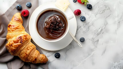 Wall Mural - Elegant Breakfast Setting with Golden Croissant, Fresh Berries, Rich Hot Chocolate in White Cup, Marble Table Surface