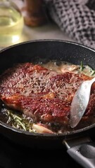 Poster - Chef pours melted butter on a juicy beef steak frying on a pan in the kitchen, close-up. Process of cooking delicious beef steak.