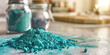 © Lila Patel - Teal powder spills onto a counter, its scent filling the air.