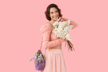 Poster - Happy young woman with bouquet of blooming white lilac flowers on pink background