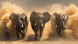 Fototapeta  - Three elephants run in the desert, with dust flying behind them and motion blur.
