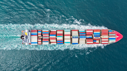 express cargo container ship with contrail in the ocean ship carrying container and running for expo