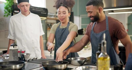 Canvas Print - Man, woman and chef for cooking class in kitchen restaurant or culinary, experience or teaching. Professional, students and vegetable at stove for recipe education or learning skills, course or food