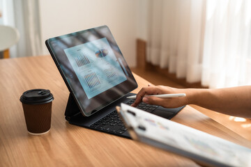 person typing on a digital tablet