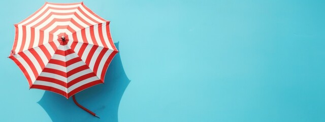 Poster - Seaside Bliss: Summer Accessories and Beach Umbrella Laid Flat on Blue