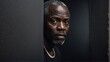 © Arceli - middleaged african man peeking on a wall on plain black background from Generative AI