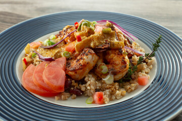 A closeup view of a plate of curry shrimp.