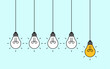 © natrot - Hanging light bulbs with one glowing on blue background. Concept of idea
