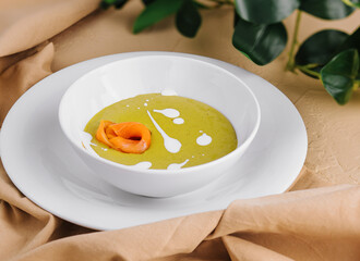 Wall Mural - Delicious green spinach cream-soup with salmon