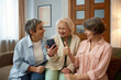 © Nomad_Soul - Retired women friends looking on smartphone screen