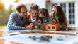 © Narongsak - Happy family planning their new home with a miniature model. A moment of joy and togetherness as they discuss and dream about their future home.