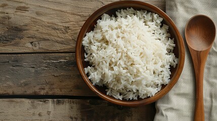 Poster - A wooden bowl filled with cooked white rice sits next to a wooden spoon on a wooden table. Generative AI