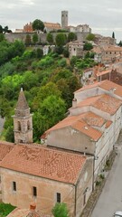 Wall Mural - Aerial view of the picturesque historic town of Motovun, Istria region, Croatia. Medieval Motovun village on the hill.