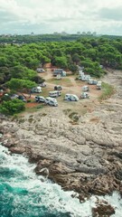 Wall Mural - Aerial view of the Camping site with parked motorhomes at Adriatic Sea rocky coast near Pula, Istria region, Croatia. Family vacation travel RV, holiday trip in motorhome, Caravan car Vacation.