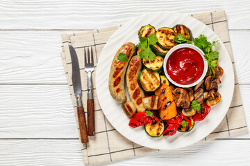 Wall Mural - grilled white sausages with veggies and mushrooms