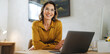 © Jacob Lund - Happy businesswoman working towards success in an office