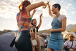 © Jacob Lund - Group of female friends enjoy themselves with dance and celebration at a music festival