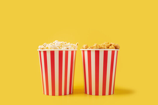 Popcorn bucket salty and sweet choose, cinema snack pack, tasty crunchy treat, yellow background