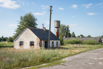 Abandoned brick house with broken windows	