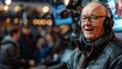 © Oskar - An enthusiastic male broadcaster in a warm jacket reports live with a microphone at a sports event surrounded by a crowd and cameras