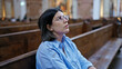 © Krakenimages.com - Young beautiful hispanic woman sitting on a church bench at St. Karl BorromÃ¤us church