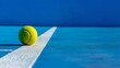 © Irina Ukrainets - Tennis ball on blue court with white line. Sport stock photo, perfect for websites and blogs. Bright colors and minimalist style. AI