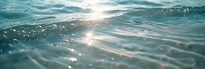 Wall Mural - Bright sunlight reflecting on ocean waves creating a magical display of water sparkles.