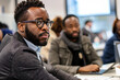© wolfhound911 - Multicultural male entrepreneurs, collaborating on a venture philanthropy project to support education and entrepreneurship in underserved communities, leveraging their resources and expertise to