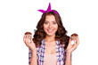 © deagreez - Portrait of nice cheerful girlish attractive adorable good mood wavy-haired lady wearing checkered shirt holding in hands two fresh muffins isolated over violet pastel background