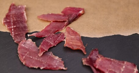 Wall Mural - dried pork meat with spices and salt on the table, dry pork meat with salt and spices for flavor for long-term storage