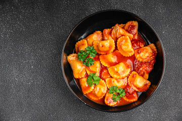 Wall Mural - ravioli beef meat tomato sauce fresh cooking appetizer meal food snack on the table copy space food background rustic top view