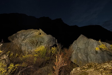 Canvas Print - Russia. The South of Western Siberia, the Altai Mountains. Night view of the clusters of huge stones in the valley of the Chulyshman River at the foot of the Katu-Yaryk pass.